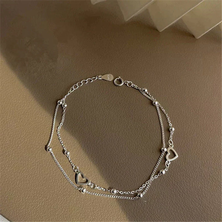 Braccialetto in argento regolabile con ciondolo a forma di cuore