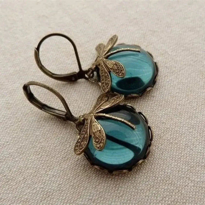 Orecchini vintage sferici dorati con libellula