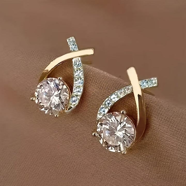 Orecchini a croce in zirconio color oro