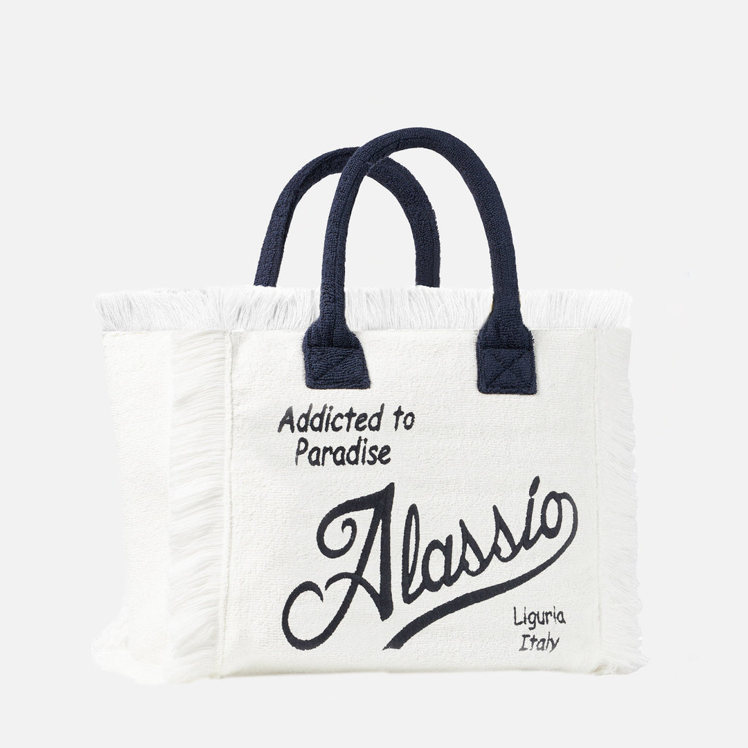 "Borsa a Spalla Vanity in Spugna con Ricamo Alassio" can be rewritten as: "Borsa Vanity in Spugna con Ricamo Alassio per Spalla".
