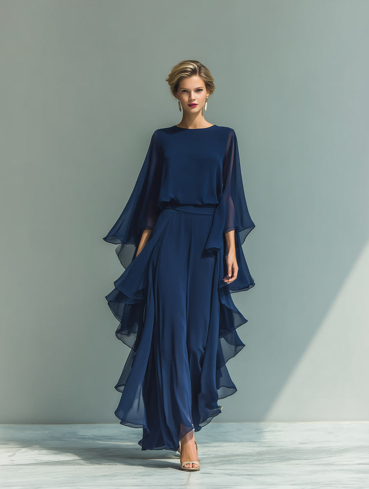 Top blu scuro con pantaloni dritti con volant
