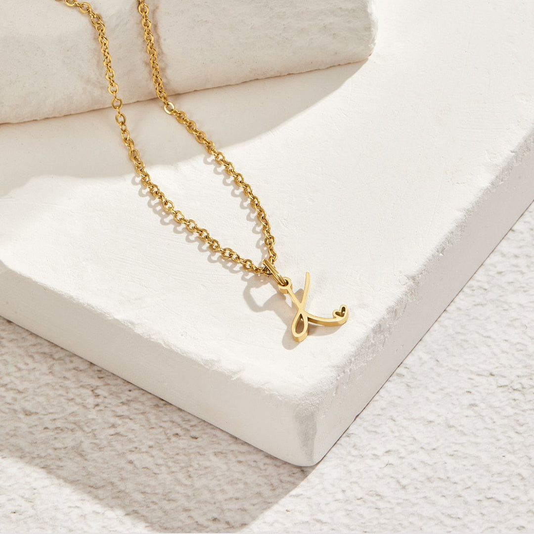 Collana a cuore con iniziali dorate